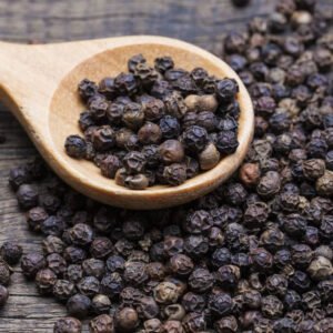 Black Pepper in wooden scoop