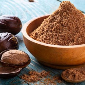 Nutmeg powder in a wooden bowl