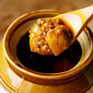 Mango pickle spoon in pot